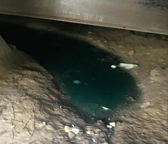Puddles of water in Santee mobile homes crawl space