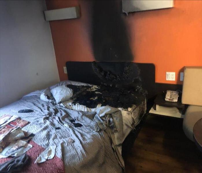 Motel room fire causes extreme fire and smoke damage.