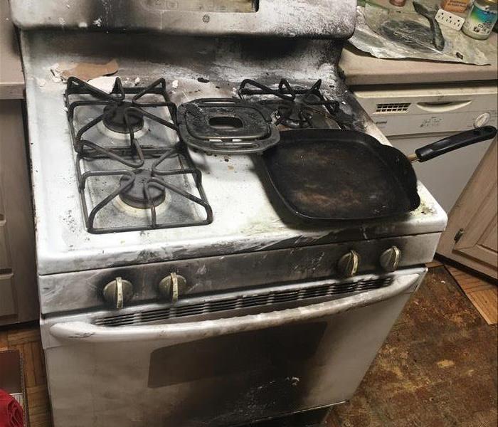 Stove fire in Chula Vista, San Diego kitchen causes extreme fire and smoke damage to cabinets and flooring