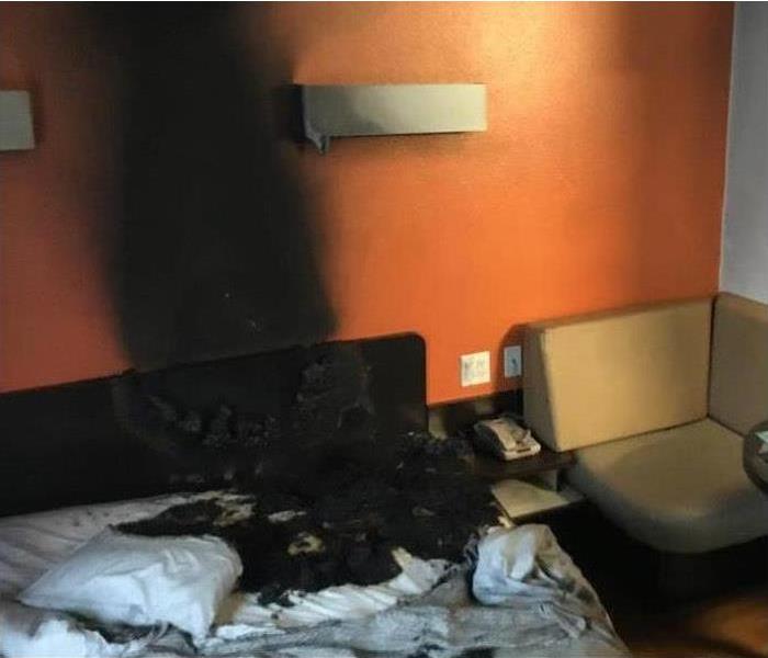 Hotel fire due to smoking cigarettes causes fire, smoke, and water damage due to the sprinkler system