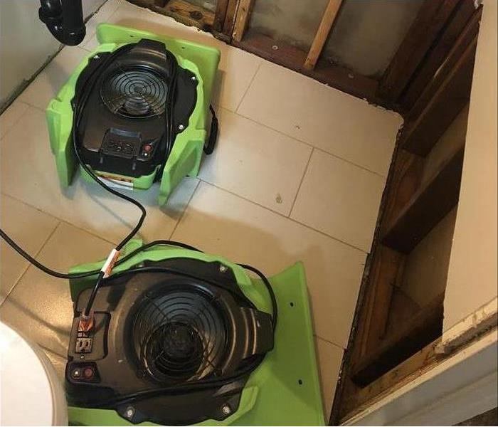 SERVPRO team uses water dehydration fans to circulate air and dry out a flooded or water damaged area.